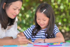 mother-teach-daughter-asian-children-doing-school-homework-home-garden-park-1024x683